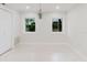This bright room offers two windows, neutral paint, and a pendant light at 680 George S St, Tarpon Springs, FL 34688
