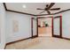 A living room features tile floors, wood trim and doorway access to kitchen at 680 George S St, Tarpon Springs, FL 34688