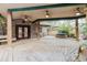 Wide planked patio area featuring stone details, fountain and covered entryway at 680 George S St, Tarpon Springs, FL 34688