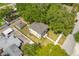 Bird's eye view of a well manicured two-story home with detached garage and mature landscaping at 7125 6Th N Ave, St Petersburg, FL 33710