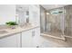 Bright bathroom with a double vanity and walk-in shower at 7125 6Th N Ave, St Petersburg, FL 33710