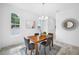 Dining room with a wood table, modern decor, and a large window at 7125 6Th N Ave, St Petersburg, FL 33710