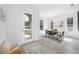 Bright dining room featuring tile floors, modern lighting, and a view of the front yard at 7125 6Th N Ave, St Petersburg, FL 33710