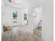 Hallway featuring tile flooring, a front door and a view of the dining room at 7125 6Th N Ave, St Petersburg, FL 33710