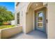 Close up of the home's facade showing the modern, recessed front door and front porch area at 7125 6Th N Ave, St Petersburg, FL 33710