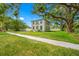 Charming two-story home with manicured lawn and mature trees, nestled in a peaceful neighborhood at 7125 6Th N Ave, St Petersburg, FL 33710