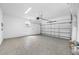 Spacious garage with an epoxy floor and open door at 7125 6Th N Ave, St Petersburg, FL 33710