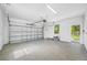 Garage featuring an epoxy floor and a standard garage door at 7125 6Th N Ave, St Petersburg, FL 33710