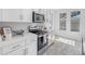 Well-lit kitchen with quartz countertops, stainless steel appliances, and a view from the window at 7125 6Th N Ave, St Petersburg, FL 33710