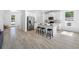 Spacious kitchen with an island, bar stools, and stainless steel refrigerator at 7125 6Th N Ave, St Petersburg, FL 33710
