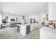 Bright, open-concept kitchen featuring stainless steel appliances and a center island with bar seating at 7125 6Th N Ave, St Petersburg, FL 33710