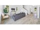 Inviting living room area featuring tile floors, a comfortable couch, and bright windows at 7125 6Th N Ave, St Petersburg, FL 33710