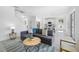 Stylish living area with modern furnishings, tile floors, and an open layout to the kitchen at 7125 6Th N Ave, St Petersburg, FL 33710