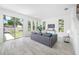 Spacious living room with sliding glass doors, tile floors, and plenty of natural light at 7125 6Th N Ave, St Petersburg, FL 33710