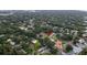 An aerial view of a home in a neighborhood, surrounded by trees at 8275 32Nd N Ave, St Petersburg, FL 33710