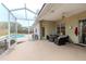 Enjoy the screened patio area with a view of the inviting pool and backyard at 8604 Herons Cove Pl, Tampa, FL 33647