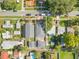 An aerial view shows the property and its proximity to nearby homes, streets, and neighborhood at 868 44Th N Ave, St Petersburg, FL 33703