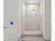 Tiled walk-in shower, designed with neutral tones and awaiting final fixtures for a modern spa-like experience at 868 44Th N Ave, St Petersburg, FL 33703
