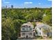 Desirable two-story home showcasing a well-manicured front lawn with a backdrop of lush greenery at 868 44Th N Ave, St Petersburg, FL 33703