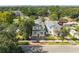 Charming two-story home with classic architecture and inviting front porch nestled amongst mature trees at 868 44Th N Ave, St Petersburg, FL 33703