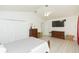 Bedroom features bright white walls, wood-look floors, a ceiling fan, and good natural light at 10011 Tranquility Way, Tampa, FL 33625