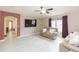 Living room featuring comfortable seating, wood floors, a flatscreen TV, and an open doorway at 10011 Tranquility Way, Tampa, FL 33625