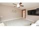 Living room with a flatscreen TV and light wood floors, offering a comfortable and stylish space at 10011 Tranquility Way, Tampa, FL 33625