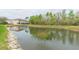 Scenic view of a pond with the building in the background at 10011 Tranquility Way, Tampa, FL 33625