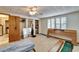 Bedroom with carpet, bright windows, a ceiling fan and light fixture and closet at 10226 N Oakleaf Ave, Tampa, FL 33612