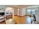 Living room featuring hardwood floors, arched doorways, and lots of natural light at 10226 N Oakleaf Ave, Tampa, FL 33612