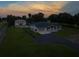 Wide aerial shot showcasing a large property with a house, guest house, and sprawling green space at 11112 Browning Rd, Lithia, FL 33547