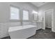 Elegant bathroom showcasing a freestanding tub, subway tile, and neutral color palette at 11112 Browning Rd, Lithia, FL 33547