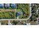 Aerial view showcases this single Gathering home, highlighting the well maintained landscaping and neighborhood at 14207 Fort Worth Cir, Port Charlotte, FL 33981