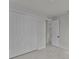 Bedroom featuring a sizable closet with bright white doors and marble floors throughout at 14207 Fort Worth Cir, Port Charlotte, FL 33981