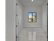Bright room with a window, neutral walls, and ceramic tile floors at 14207 Fort Worth Cir, Port Charlotte, FL 33981