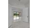 Bright, open entryway featuring marble floors, a large window view to the back yard, and neutral decor at 14207 Fort Worth Cir, Port Charlotte, FL 33981