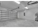 Spacious two car garage with an automatic door, overhead lighting, and plenty of room for storage at 14207 Fort Worth Cir, Port Charlotte, FL 33981