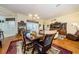 Light-filled dining area with a chandelier and view of the backyard at 1727 Lakestone Dr, Trinity, FL 34655