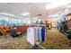 View of the golf pro shop with display racks of clothing and golf supplies at 1727 Lakestone Dr, Trinity, FL 34655