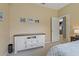 Bedroom featuring a white dresser with dark countertop and carpeted flooring at 18521 Bittern Ave, Lutz, FL 33558