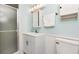 Bright bathroom with white vanity, shower, and modern fixtures at 18675 Us Highway 19 N # 217, Clearwater, FL 33764