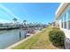 Picturesque canal view with private dock, boat lift, lush landscaping, and stunning waterfront lifestyle, perfect for relaxation at 18675 Us Highway 19 N # 217, Clearwater, FL 33764