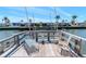 Inviting wooden dock furnished with lounge chairs, offering serene water views and relaxation at 18675 Us Highway 19 N # 217, Clearwater, FL 33764
