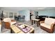 Spacious living room featuring stylish decor, wood-look floors, and a cohesive color scheme at 18675 Us Highway 19 N # 217, Clearwater, FL 33764