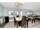 Bright and airy living area with wood-look flooring, large windows, and comfortable seating arrangement at 18675 Us Highway 19 N # 217, Clearwater, FL 33764