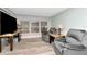 Cozy living room features wood-look floors, recliner chairs, and natural light at 18675 Us Highway 19 N # 217, Clearwater, FL 33764