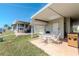 Spacious patio with outdoor dining set, perfect for entertaining with views of the canal and lush backyard at 18675 Us Highway 19 N # 217, Clearwater, FL 33764
