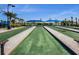 Bocce ball courts with blue canopies over seating and views of surrounding landscape at 19410 Indian Rock Pl, Lakewood Ranch, FL 34211