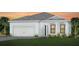 Beautiful single-Gathering home featuring a two-car garage and a well-manicured lawn at 19410 Indian Rock Pl, Lakewood Ranch, FL 34211