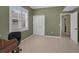 Bedroom with a chair, closet and window with shutters, offering a clean and functional space at 2075 Warwick Dr, Oldsmar, FL 34677